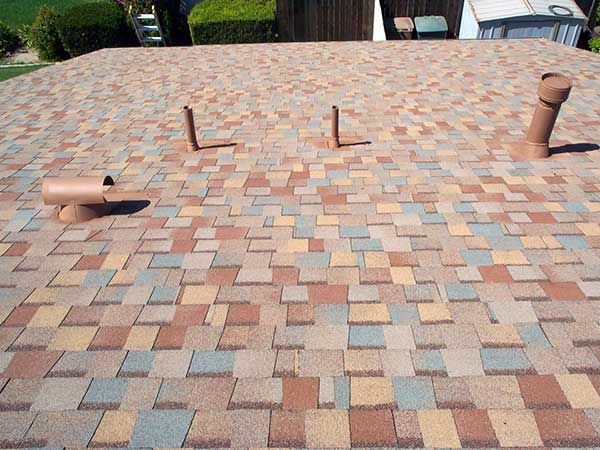 new multi-tone asphalt roof shingle installation around exhaust vents