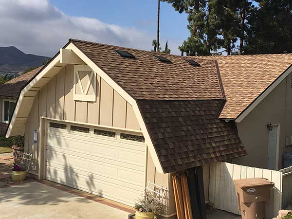 new asphalt roof shingle installation over garage