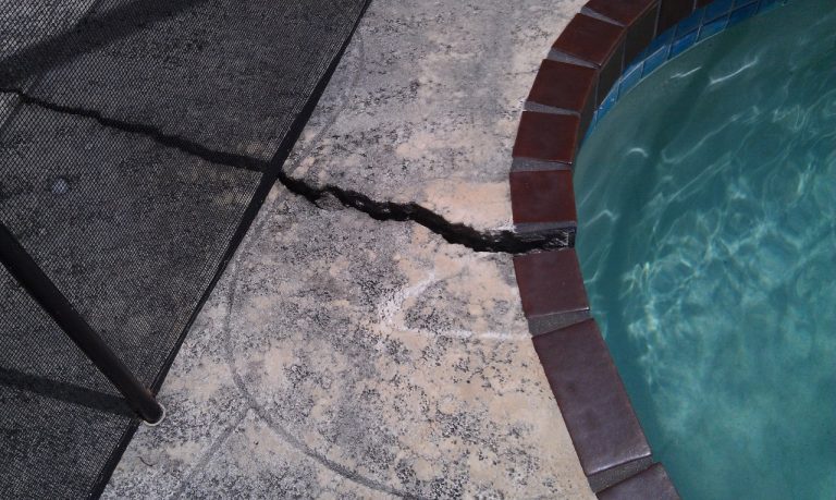 pool coping crack in need of repair by resurfacing