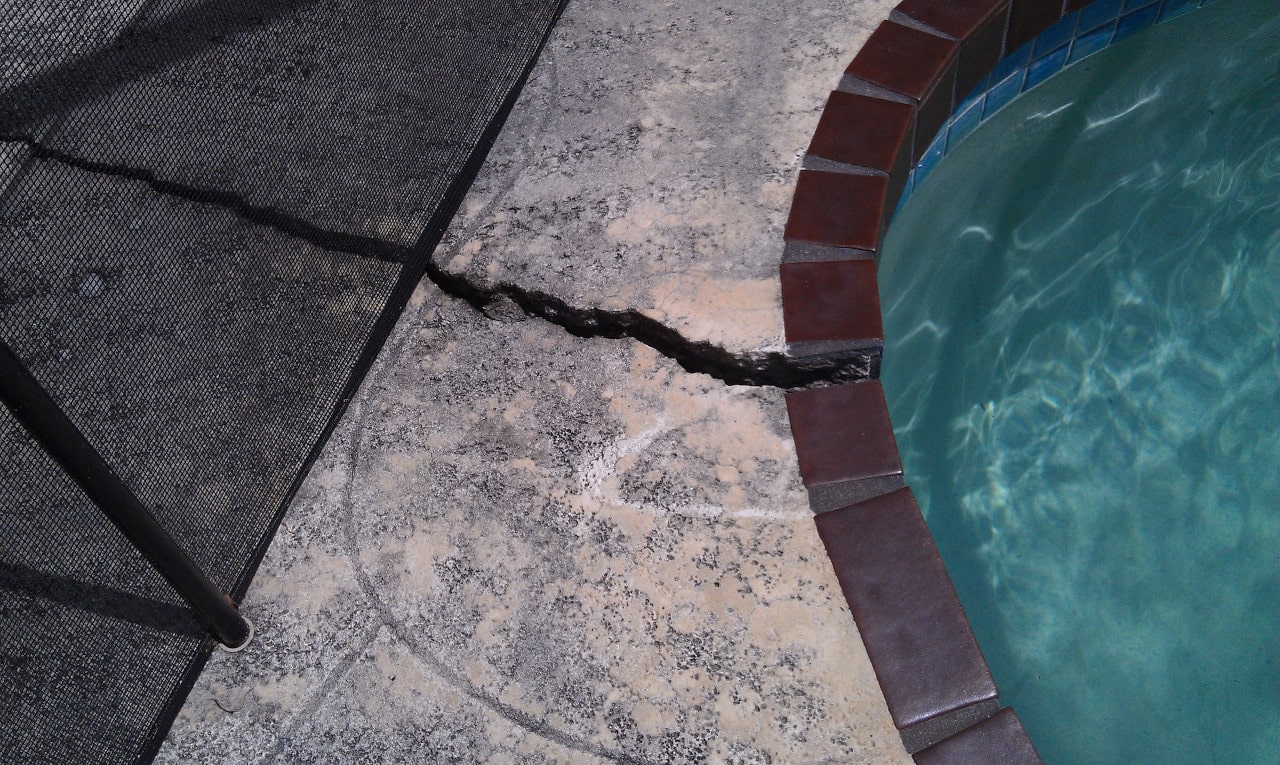 pool coping crack in need of repair by resurfacing
