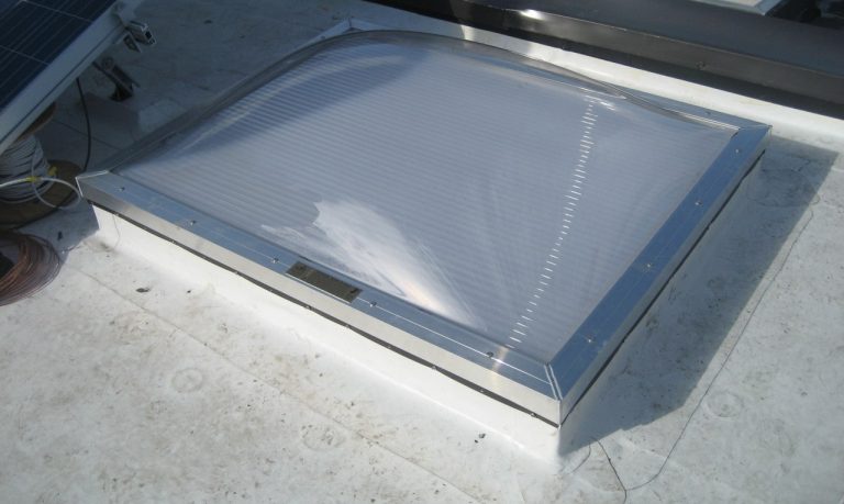 a commercial skylight installed on a flat roof